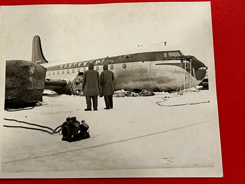 Northwest Orient Airlines Plane being taken apart - side view 1946 ca.